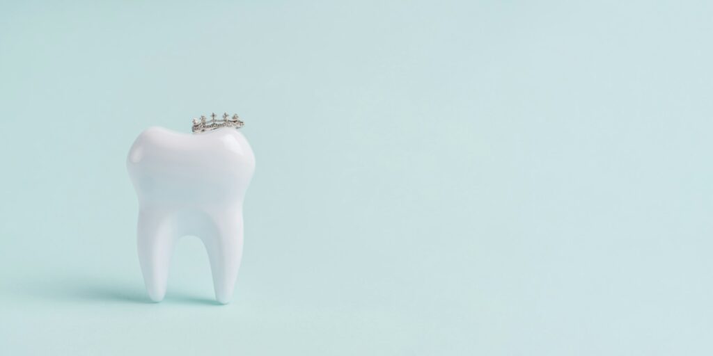 Tooth wearing a crown symbolizing same-day dental crown treatment at Northside Family Dentistry in O’Fallon, MO